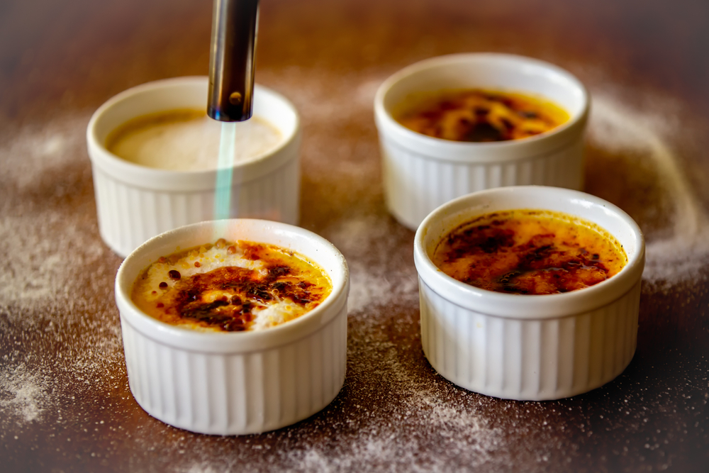 Classic creme brulé being flambé